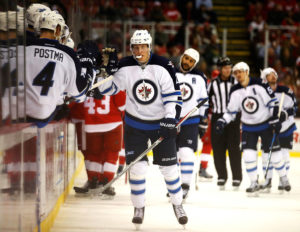 DETROIT, MI - NOVEMBER 04: Patrik Laine #29 of the Winnipeg Jets celebrates his first period goal with teammates while playing the Detroit Red Wings at Joe Louis Arena on November 4, 2016 in Detroit, Michigan. (Photo by Gregory Shamus/Getty Images)