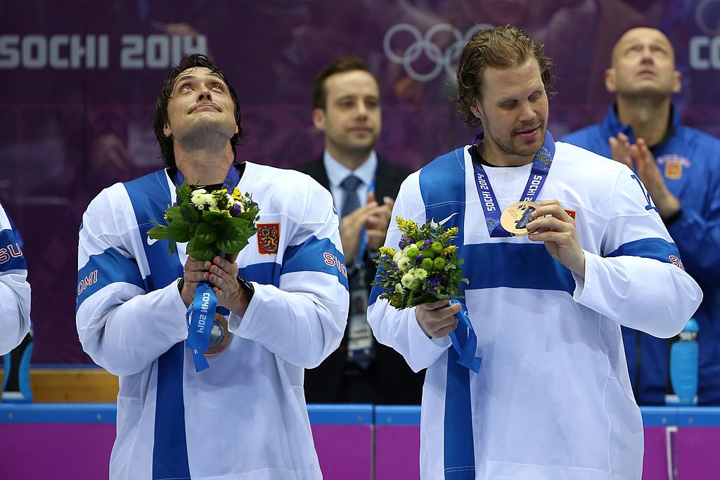 SOCHI, RUSSIA - FEBRUARY 22: Bronze medalists Teemu Selanne #8 and Olli Jokinen #12 of Finland celebrate during the medal ceremony after defeating the United States 5-0 during the Men's Ice Hockey Bronze Medal Game on Day 15 of the 2014 Sochi Winter Olympics at Bolshoy Ice Dome on February 22, 2014 in Sochi, Russia. (Photo by Bruce Bennett/Getty Images)