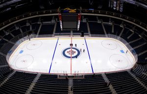Winnipeg Jets Install Logo And Lines In MTS Centre Ice