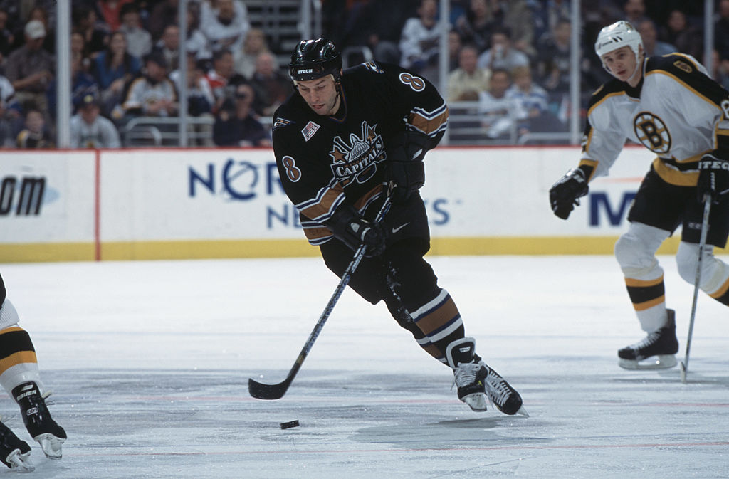 Dmitri Khristich skates with the puck